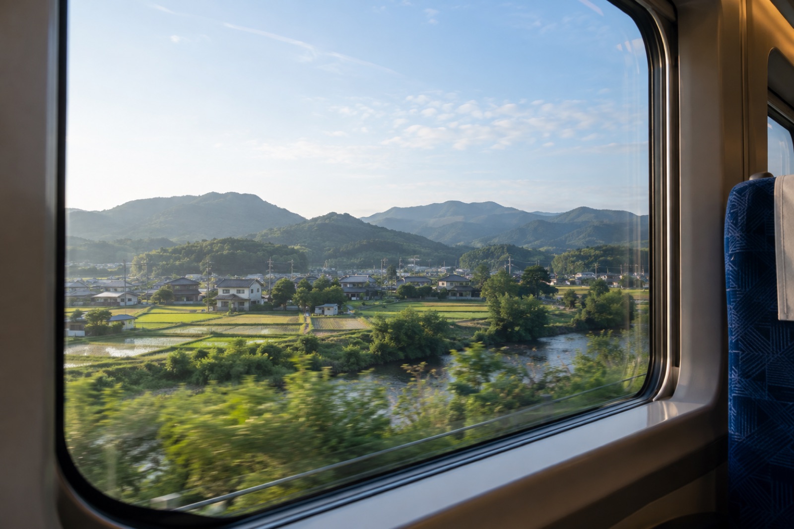 Illustration of Japanese countryside seen through a train window